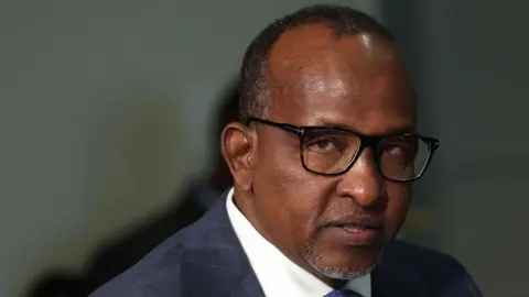 Getty Images A head-and-shoulders image of Aden Duale. A white collar and dark suit can just be seen at the bottom of the picture.