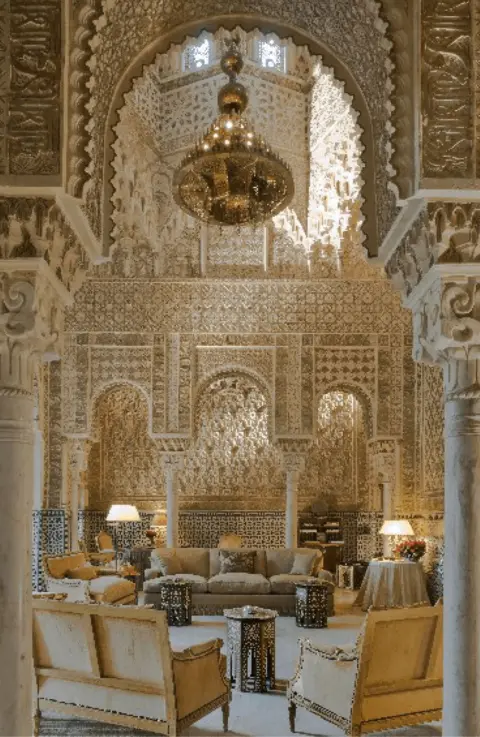 US Department of Justice Interior shot of palace with seating arranged below a huge chandelier 