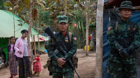 Getty Images Soldiers from the Karenni Army, the armed wing of the Karenni National Progressive Party, one of the oldest ethnic guerrillas in Myanmar, stand in a camp for internally displaced people.