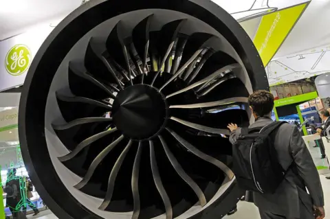Corbis via Getty Images Display of a GE General Electric engine which provides power for Boeing's new 787 Dreamliner and 747-8 long range jet. 