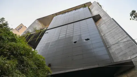 LightRocket via Getty Images A general view of the multi-storey The Daily Star building, after it was attacked, vandalized, and set ablaze in Dhaka. 
