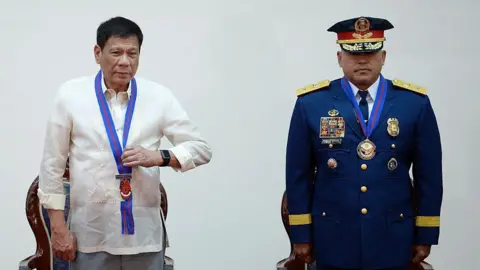 Getty Images Former Philippine President Rodrigo Duterte and his police chief General Ronald Dela Rosa also known as Bato