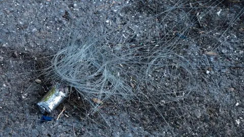 Moose Campbell/BBC Fibre optic cable lies in coils on the ground in northern Israeel