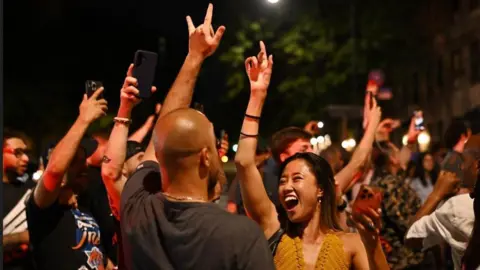 REUTERS/Dylan Martinez New York Knicks fans celebrate on the streets after becoming NBA champions 