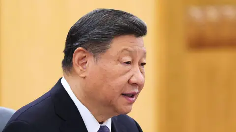 Getty Images China's President Xi Jinping speaks during a meeting at the Great Hall of the People on November 25, 2025 in Beijing, China.