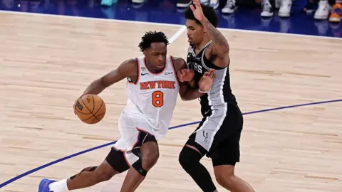 Getty Images OG Anunoby #8 of the New York Knicks drives to the basket against Dylan Harper #2 of the San Antonio Spurs during the second quarter in Game Four of the 2026 NBA Finals at Madison Square Garden on June 10, 2026 in New York City.
