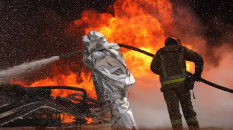 DSNS / Dnipropetrovsk region Ukrainian firefighters tackle a blaze following Russian drone strikes in the central Dnipropetrovsk region. Photo: 13 May 2026