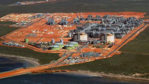 Getty An aerial view of a gas works with orange soil 
