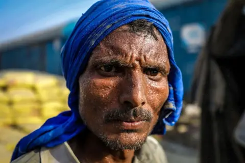 Ankit Srinivas 'After working one day, I don't have the courage to work the next,' says railway yard worker Dharampal.