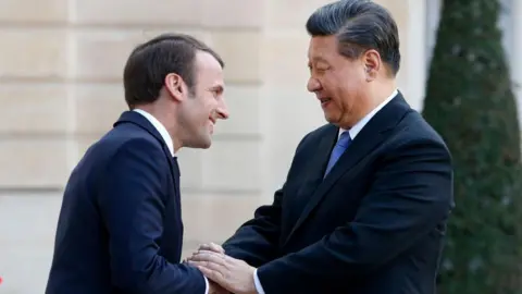 Getty French President Emmanuel Macron greets Chinese President Xi Jinping after their meeting at the Elysee Presidential Palace on March 26, 2019 in Paris, France. Xi Jinping is on a state visit to France from March 24 to 26, 2019.
