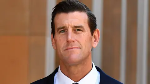 Getty Images Ben Roberts-Smith looks at the camera, wearing a suit