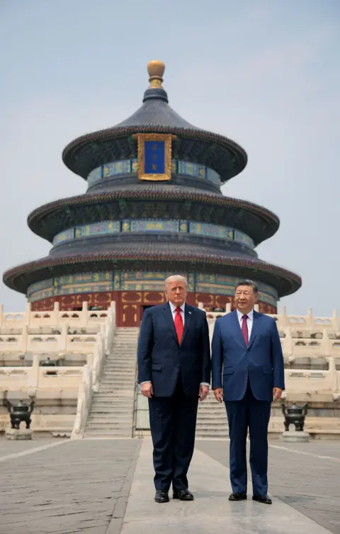 Reuters U.S. President Donald Trump and Chinese President Xi Jinping stand together as they tour the Temple of Heaven in Beijing, China, May 14, 2026.