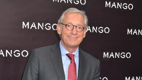 Foc Kan/WireImage A 2011 pic of a Isak Andic, with grey hair and a red tie and suit