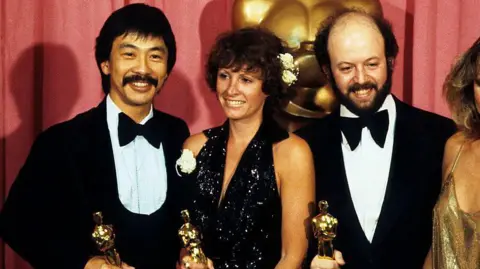 Getty Images Marcia Lucas and her fellow Oscar winners Richard Chew and Paul Hirsch holding their golden trophies at the 1978 Academy Awards
