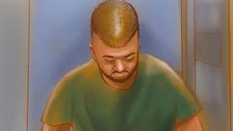 Rocco Fazzari/Getty Images A court sketch of a man with shaved head and green t-shirt with his head bowed.