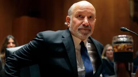 Getty Images US Secretary of Commerce Howard Lutnick wears a suit while arriving to testify during a Senate Appropriations Subcommittee on Commerce, Justice, Science, and Related Agencies hearing on February 10, 2026.