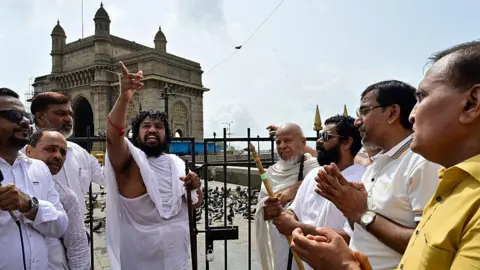 Hindustan Times via Getty Images Followers of Jain religion participated in a protest rally against the closure of kabutar khanas across the city by BMC, rally held from Colaba jain temple to Gateway of India, on August 3, 2025 in Mumbai, India