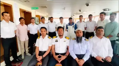 Rashedul Hasan This is a screengrab of video shot by the high-ranking officers of Banglar Joyjatra to boost the crew's morale. Captain Islam is the second man from the right in the front row and Chief Engineer Rashedul Hasan sits to the left to the captain