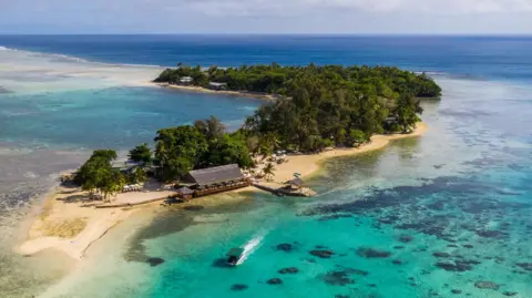 Getty Images One of Vanuatu's islands, surrounded by turquoise waters