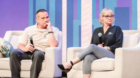CrimeCon and RenownedPhotos The parents of victims like Kaylee Goncalves sit on the stage during a Q&A