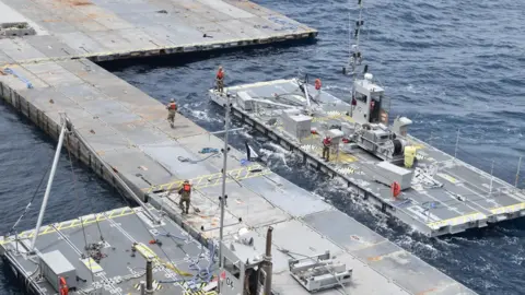 Reuters US military handout photo showing floating pier being constructed off the coast of Gaza (6 May 2024)
