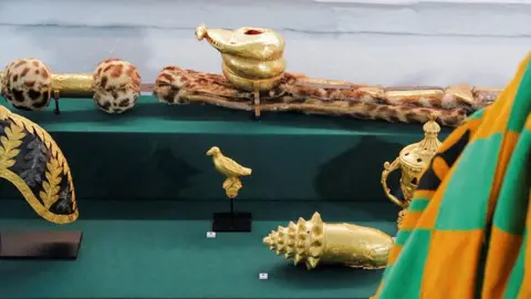 Reuters A man looking at the objects on display at the Manhyia Palace Museum