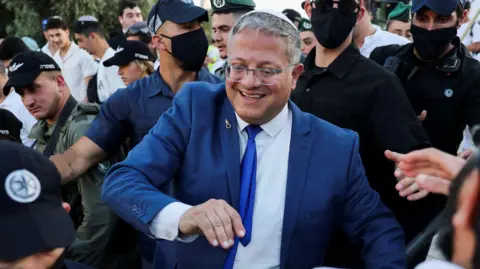 Reuters Israeli National Security Minister Itamar Ben-Gvir leads a group of nationalists through East Jerusalem to the al-Aqsa mosque compound on Jerusalem Day (14 May 2026)