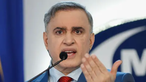 AFP via Getty Images Venezuela's Attorney General Tarek William Saab speaks during a press conference in Caracas on July 21, 2025
