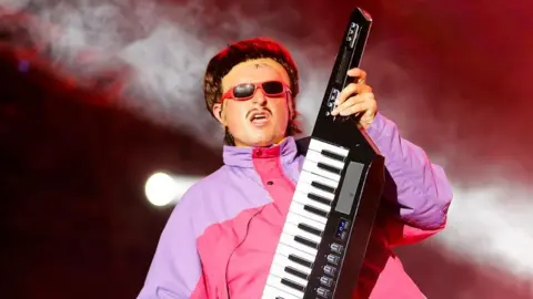 Getty Images Oliver Tree performing wearing shades and playing a keytar during the Exit Festival in Serbia in 2024