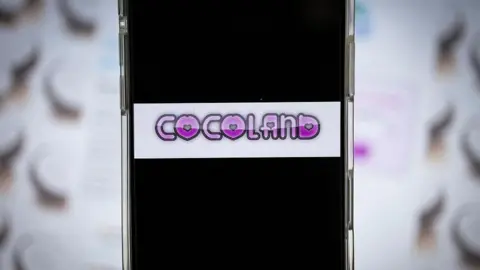 Getty Images A phone screen showing the Cocoland banner
