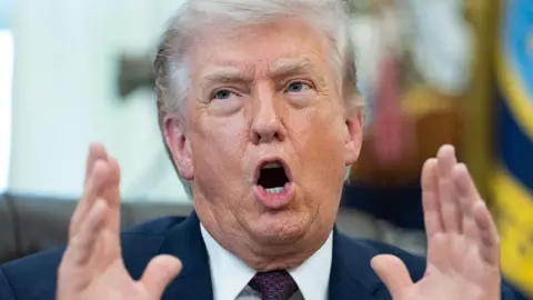 Getty Images Donald Trump gesturing in the Oval Offive