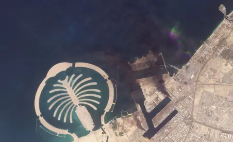 Planet Labs PBC via REUTERS A satellite image of Jebel Ali Port, after one of the berths caught fire because of debris from an intercepted missile, in Dubai, United Arab Emirates, March 1, 2026. 