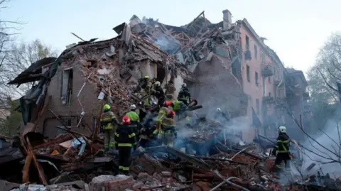State Emergency Service of Ukraine Rescue workers searching the ruins of a collapsed building in Ukraine 