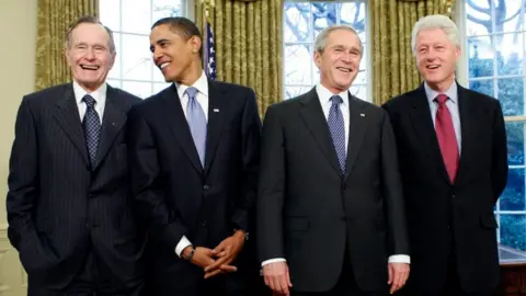 Reuters George HW Bush (L-R), Barack Obama, George W Bush and Bill Clinton