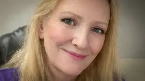Kate Grosmaire A photo of a blonde woman looking at the camera
