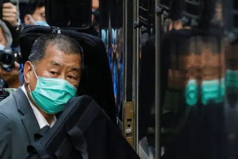 Reuters Media tycoon Jimmy Lai, founder of Apple Daily, looks on as he leaves the Court of Final Appeal by prison van, in Hong Kong, China February 1, 2021