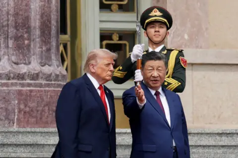 Getty Images U.S. President Donald Trump and Chinese President Xi Jinping attend a welcome ceremony at the Great Hall of the People on May 14, 2026 in Beijing, China. 