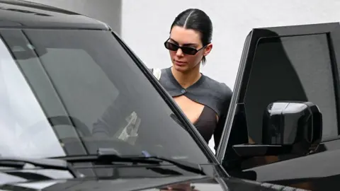 Getty Images Kendall Jenner getting into a black SUV