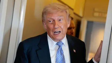 REUTERS/Evan Vucci/File Photo U.S. President Donald Trump speaks to the press aboard Air Force One enroute to the U.S. following his official visit with President Xi Jinping in China, May 15, 2026. 