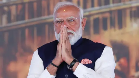 Reuters India's Prime Minister Narendra Modi is seen joining his hands in a greeting at a recent event in Kolkata in West Bengal on May 9, 2026. REUTERS/Sahiba Chawdhary