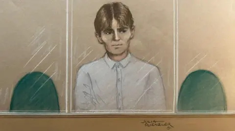 Julia Quenzler A court sketch of a young man sat in court. He is wearing a white shirt and has medium-length brown hair with a middle parting. 