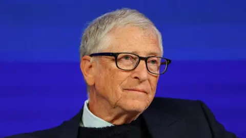 Reuters A file photo of Bill Gates - he is seated on stage at an event 