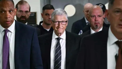 Getty Images Microsoft co-founder Bill Gates (C) arrives for a closed-door interview with the House Oversight Committee on Capitol Hill in Washington, DC, on June 10, 2026.