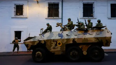 Reuters Security forces patrol after a violence outbreak, in Quito