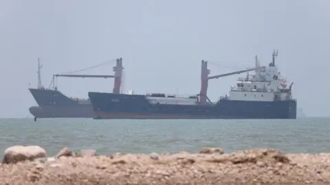Reuters Two ships seen in the Strait of Hormuz off Iran's Bandar Abbas