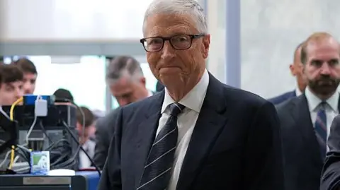 Getty Images Bill Gates walks through security as he arrives to testify at a closed-door interview with the House Oversight Committee on Capitol Hill

