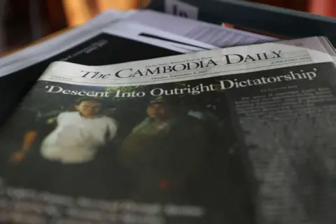 Getty Images A copy of the final issue of the Cambodia Daily on a desk at the newspaper's office.
