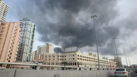 Getty Images Smoke rises after Iran launched a missile attack targeting the headquarters of the US Navy's Fifth Fleet in Bahrain, following what it described as retaliation against US and Israeli strikes.