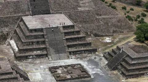 EPA An aerial view shows investigators patrolling the area of the Pyramid of the Moon in the municipality of San Juan Teotihuacan in the State of Mexico, Mexico, 21 April 2026. 