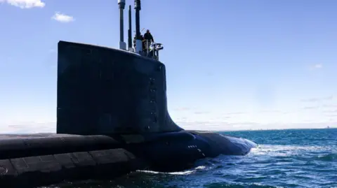 Getty Images A US Virginia-class attack submarine, only partially submerged, sailing off the coast of Western Australia